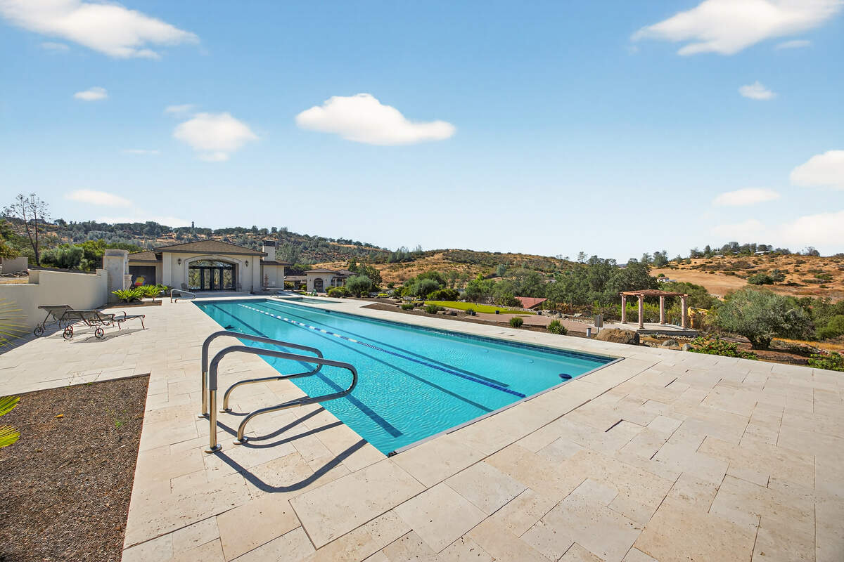 The pool and pool house, which functions as a private recreation center, include an 82-foot junior Olympic lap pool, children’s pool, hot tub, locker rooms, commercial-grade kitchen, bar and entertainment space.